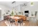 Bright living room with a fireplace, dining area, open layout, and high ceilings for an airy feel at 2540 Beech Gap Ct, Raleigh, NC 27603
