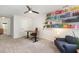 Well-lit office with adjustable desk, comfortable chair, and built-in bookshelves at 2540 Beech Gap Ct, Raleigh, NC 27603