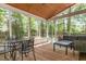 Cozy screened porch with furniture and natural light, perfect for outdoor relaxation at 2540 Beech Gap Ct, Raleigh, NC 27603