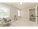 Neutral bedroom features chair, windows, and a full length mirror at 3004 Red Cir, Willow Springs, NC 27592