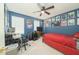 This bedroom features blue walls adorned with posters and equipped with a desk and a red bed at 3004 Red Cir, Willow Springs, NC 27592