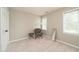 Minimal bedroom features natural light, neutral walls, and cozy chair at 3004 Red Cir, Willow Springs, NC 27592