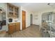 Bright kitchen area with wood cabinetry, offering ample counter space, and a view into the eat-in kitchen at 3004 Red Cir, Willow Springs, NC 27592