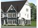 New construction two story townhouse with a modern dark gray and white facade and detailed architectural features at 3018 White Rail Dr, Fuquay Varina, NC 27526