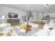 Open concept floorplan with living room, dining area and kitchen featuring light wood floors and stairs at 3018 White Rail Dr, Fuquay Varina, NC 27526