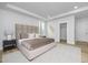 Tranquil primary bedroom featuring recessed lighting, a large bed, and neutral decor at 3018 White Rail Dr, Fuquay Varina, NC 27526