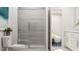 Modern bathroom with a glass-enclosed shower and a view into the primary bedroom at 334 Carolina Springs Blvd, Apex, NC 27539
