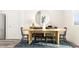 Bright and airy dining room with stylish decor, including a wooden table and eye-catching mirror at 334 Carolina Springs Blvd, Apex, NC 27539