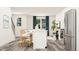 Open-concept kitchen with breakfast bar and seating, seamlessly connecting to the living space at 334 Carolina Springs Blvd, Apex, NC 27539