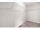 Walk-in closet with wire shelving for organization and neutral carpeting at 364 Springtime Fields Ln, Wake Forest, NC 27587