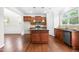 Open kitchen boasts granite countertops, stainless appliances, wood cabinets, and an island at 364 Springtime Fields Ln, Wake Forest, NC 27587