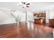 Open concept living area boasts hardwood floors and stairs to the second story at 364 Springtime Fields Ln, Wake Forest, NC 27587