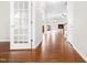 Inviting living room with hardwood floors and a fireplace, seamlessly connects to the kitchen at 364 Springtime Fields Ln, Wake Forest, NC 27587