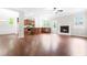 Open concept living area features hardwood floors and fireplace, adjacent to the kitchen at 364 Springtime Fields Ln, Wake Forest, NC 27587