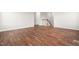 Spacious living room with hardwood floors and a staircase is filled with natural light at 364 Springtime Fields Ln, Wake Forest, NC 27587