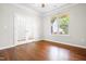 Home office featuring hardwood flooring, natural light and framed french doors at 364 Springtime Fields Ln, Wake Forest, NC 27587