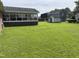 Spacious backyard showcasing a lush lawn and the exterior of the home at 405 Taylor Dr, Rocky Mount, NC 27803