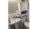 Functional bathroom with white fixtures, including a pedestal sink and toilet with storage above at 405 Taylor Dr, Rocky Mount, NC 27803
