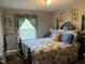 Inviting bedroom with elegant decor and patterned bedding at 405 Taylor Dr, Rocky Mount, NC 27803