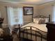 Comfortable bedroom with a plush bed and lots of natural light at 405 Taylor Dr, Rocky Mount, NC 27803
