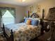 Charming bedroom featuring floral bedding and bright accents at 405 Taylor Dr, Rocky Mount, NC 27803