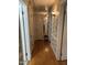 Hallway with hardwood floors and charming wallpaper at 405 Taylor Dr, Rocky Mount, NC 27803