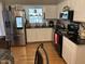 Well-lit kitchen featuring stainless steel appliances and white cabinetry at 405 Taylor Dr, Rocky Mount, NC 27803