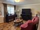 Comfortable living room with plush seating, fireplace, and natural light at 405 Taylor Dr, Rocky Mount, NC 27803