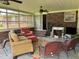 Spacious sunroom with brick accent wall, fireplace, and seating, perfect for year-round enjoyment at 405 Taylor Dr, Rocky Mount, NC 27803