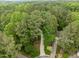 Aerial view of lush, green neighborhood with tree-lined streets and well-maintained homes at 406 Bakewell Ct, Wake Forest, NC 27587