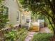 View of back exterior of the home showcasing the wooden deck with stairs leading down into the backyard at 406 Bakewell Ct, Wake Forest, NC 27587
