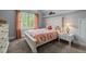 Cozy bedroom with natural light, a white headboard, and neutral decor at 406 Bakewell Ct, Wake Forest, NC 27587