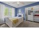 Inviting bedroom with a comfortable bed, large window, and a closet at 406 Bakewell Ct, Wake Forest, NC 27587