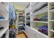 Spacious walk-in closet with custom shelving and ample storage for clothes and accessories at 406 Bakewell Ct, Wake Forest, NC 27587