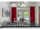 Kitchen with granite countertops, breakfast bar, and a view of the dining area and outside patio at 406 Bakewell Ct, Wake Forest, NC 27587