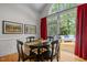 Bright dining area includes access to the outdoor deck and views of the beautifully landscaped backyard at 406 Bakewell Ct, Wake Forest, NC 27587