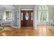 Inviting foyer featuring beautiful hardwood floors, stylish entryway, and natural light at 406 Bakewell Ct, Wake Forest, NC 27587