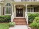 Charming front porch with brick steps and lovely entryway to the home at 406 Bakewell Ct, Wake Forest, NC 27587