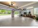 Spacious two-car garage featuring ample storage, workbench, and natural light at 406 Bakewell Ct, Wake Forest, NC 27587