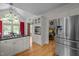 Kitchen features stainless appliances, granite countertops, and flows into the dining and living areas at 406 Bakewell Ct, Wake Forest, NC 27587