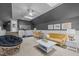 Cozy living room with skylights, a yellow couch, and modern decor at 406 Bakewell Ct, Wake Forest, NC 27587