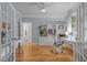 Bright home office with built-in bookshelves, light blue walls, and a ceiling fan at 406 Bakewell Ct, Wake Forest, NC 27587