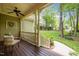 View from the front porch showing outdoor seating and well-manicured front lawn at 406 Bakewell Ct, Wake Forest, NC 27587