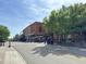 Street view of downtown with shops, cafes, and pedestrian activity on a sunny day at 406 Bakewell Ct, Wake Forest, NC 27587