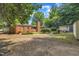 Expansive backyard with mature trees and lush landscaping at 424 Raleigh View Rd, Raleigh, NC 27610