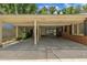 Spacious carport offering covered parking with extra storage space, leading to the home's entrance at 424 Raleigh View Rd, Raleigh, NC 27610