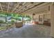 Large covered patio area with fan, ideal for outdoor entertaining and relaxing in a private setting at 424 Raleigh View Rd, Raleigh, NC 27610