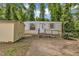 Exterior of home features a ramp, shed, and mature trees surrounding the property, offering a private setting at 424 Raleigh View Rd, Raleigh, NC 27610
