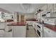 Spacious kitchen with island, ample cabinet space, and a complete appliance set at 424 Raleigh View Rd, Raleigh, NC 27610