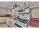 Functional kitchen features appliances, ample cabinet space, and counter tops at 424 Raleigh View Rd, Raleigh, NC 27610
